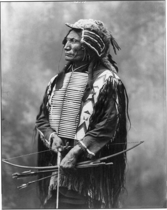 Broken Arm, Oglala Sioux, holding bow and arrow - Heyn Photo - 1899.jpg